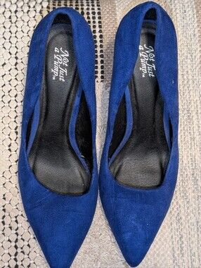 Not Just a Pump brand blue suede pointed-toe heels.